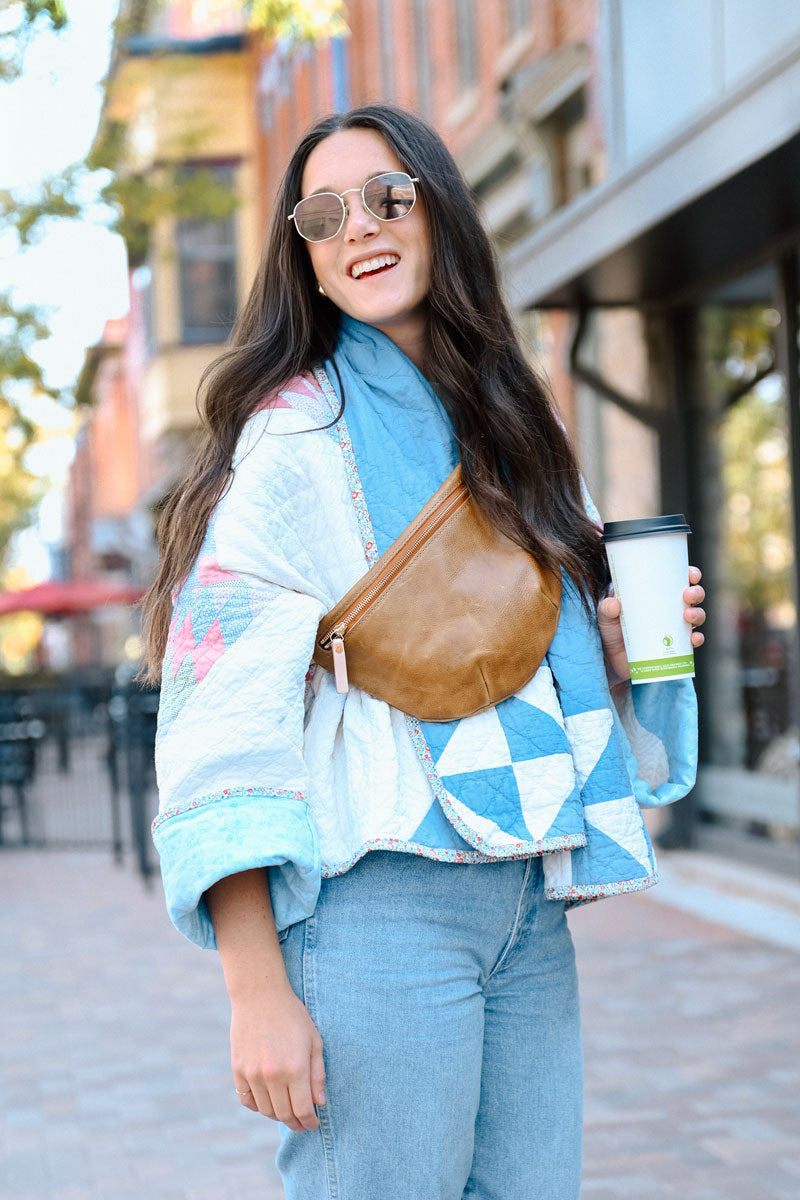 woman with brown leather fanny bag