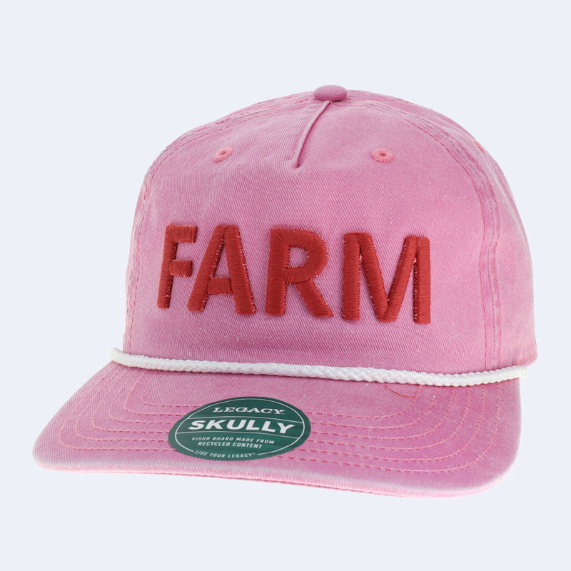 A pink trucker hat that says farm in red letters