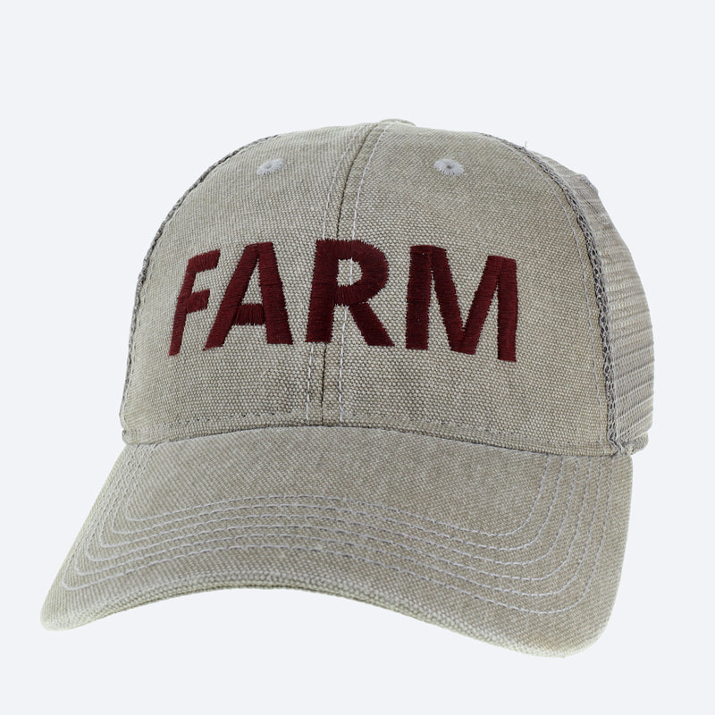 A beige baseball cap that says farm in maroon letters