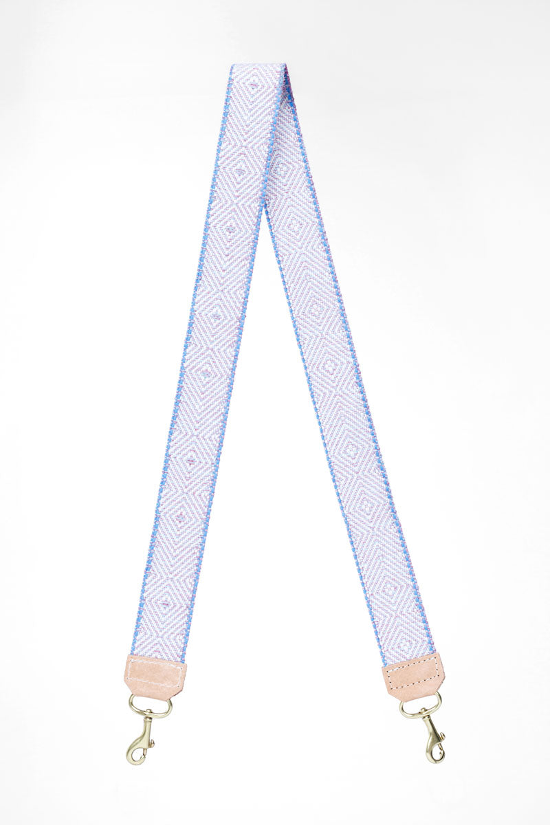 Light blue/pink design on webbing crossbody strap