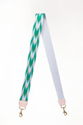 Light blue and green patterned webbing crossbody strap folded in half