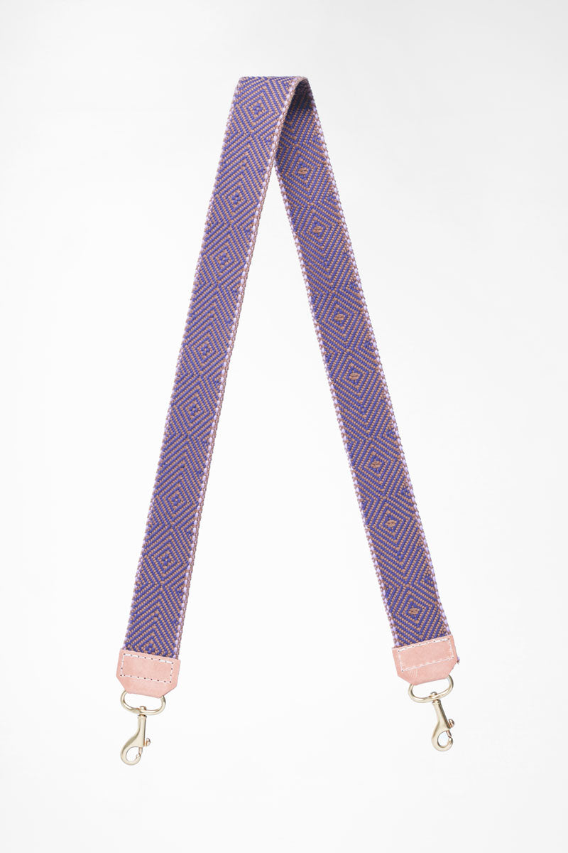 Purple and pink patterned webbing crossbody strap folded in half